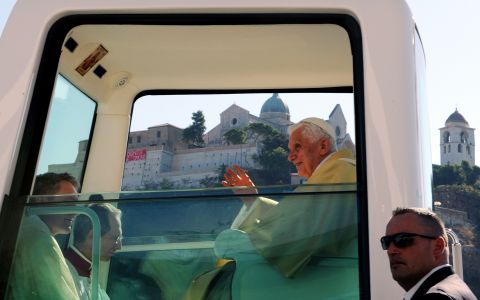 This Popemobile (photographed in September 2011) is fitted with a religious image just above the pope's seat.