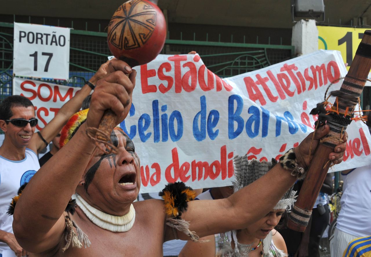 People chant slogans during a protest against the demolition of the Celio de Barros track and field stadium in Rio de Janeiro, Brazil on January 13, 2013. The stadium needs to be demolished to carry out the Maracana stadium construction plans ahead of the 2013 FIFA Confederations Cup, 2014 FIFA World Cup and 2016 Olympic games.