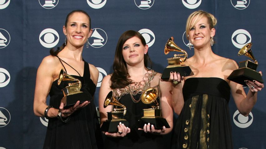 Los Angeles, UNITED STATES: Winners of Best Record of the Year, Best Album of the Year, Best Song of the Year, Best Country Performance By A Duo Or Group With Vocal and Best Country Album, the Dixie Chicks, Emily Robison (L), Natalie Maines (M) and Martie Maguire (R) pose with the trophies at the 49th Grammy Awards in Los Angeles 11 February 2007. The outspoken country trio the Dixie Chicks swept the 49th Grammy awards with their hit single 'Not Ready To Make Nice,' a song that tackles their vocal criticism of US President George W. Bush. AFP PHOTO/Gabriel BOUYS (Photo credit should read GABRIEL BOUYS/AFP/Getty Images) 