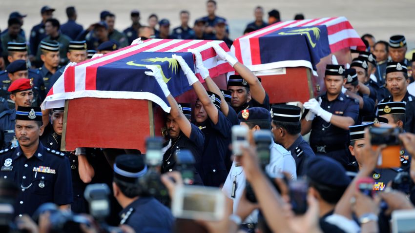The bodies of Malaysian police officers killed in an ambush in Semporna, arrive in Kuala Lumpur on March 4, 2013.
