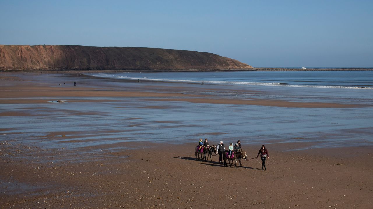 Tourists enjoy donkey rides on Filey Beach on March 2 in Filey, England.