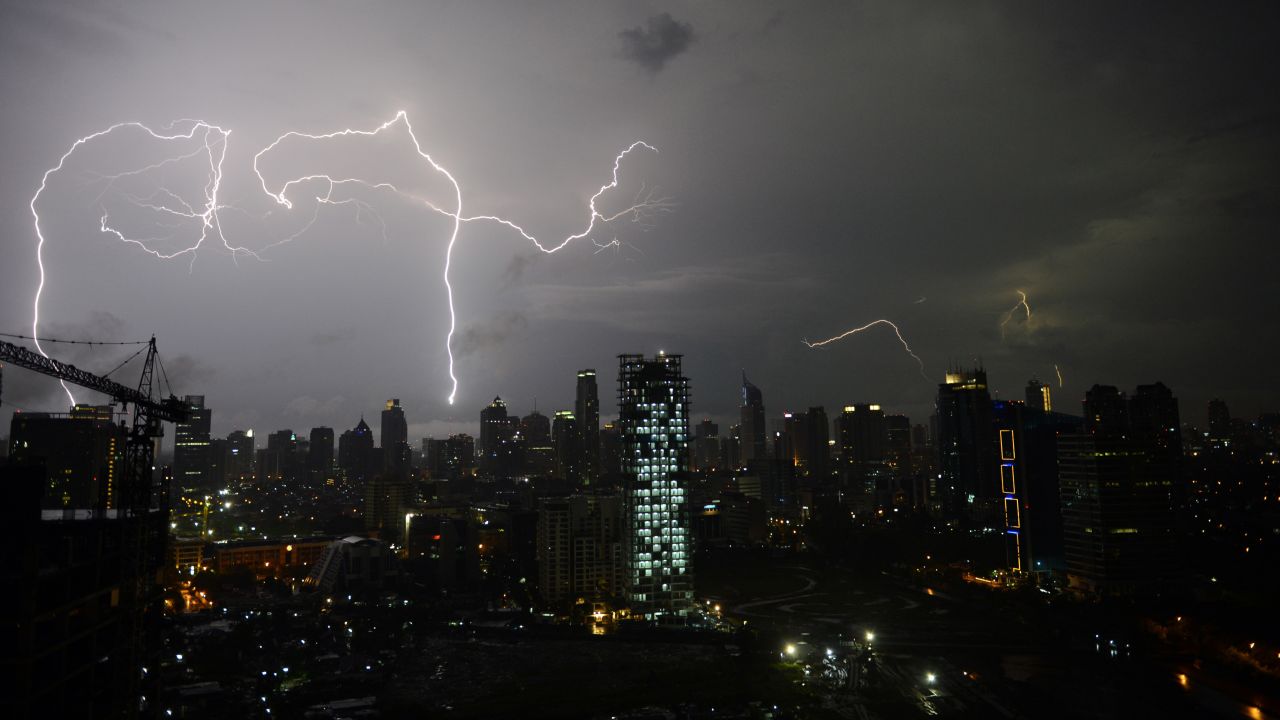Lightning strikes over Jakarta's skyline late on March 3 during monsoon rains.