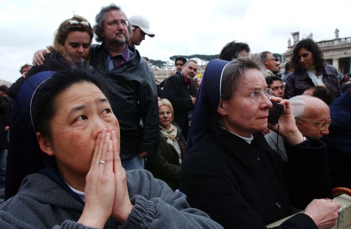 Nuns wait for the announcement of the name of the new pope after white smoke rose from the Sistine Chapel signaling a pope had been elected during the second day of the conclave on April 19, 2005. 