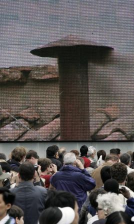 In 2005, crowds of people gathered in front of a giant screen showing the Sistine Chapel chimney.