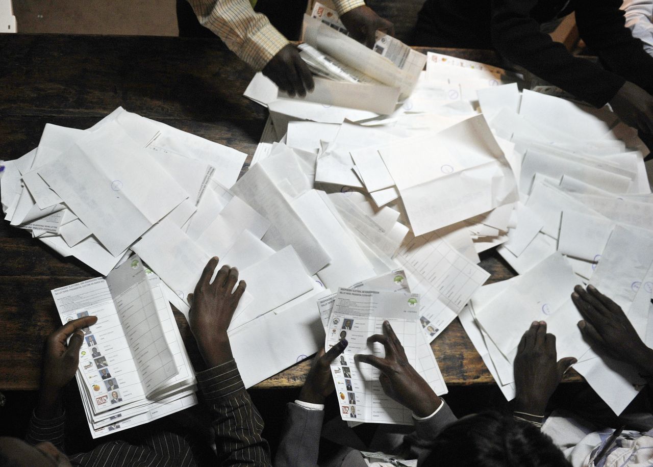 Poll officials count ballots at a polling centre following Kenya's national elections on March 4, 2013 in the country's western province in Kakamega.