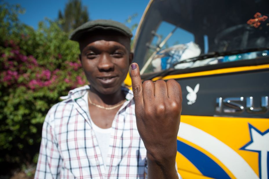 A man shows his inked finger, which marks that he has voted in Kangemi, Nairobi.