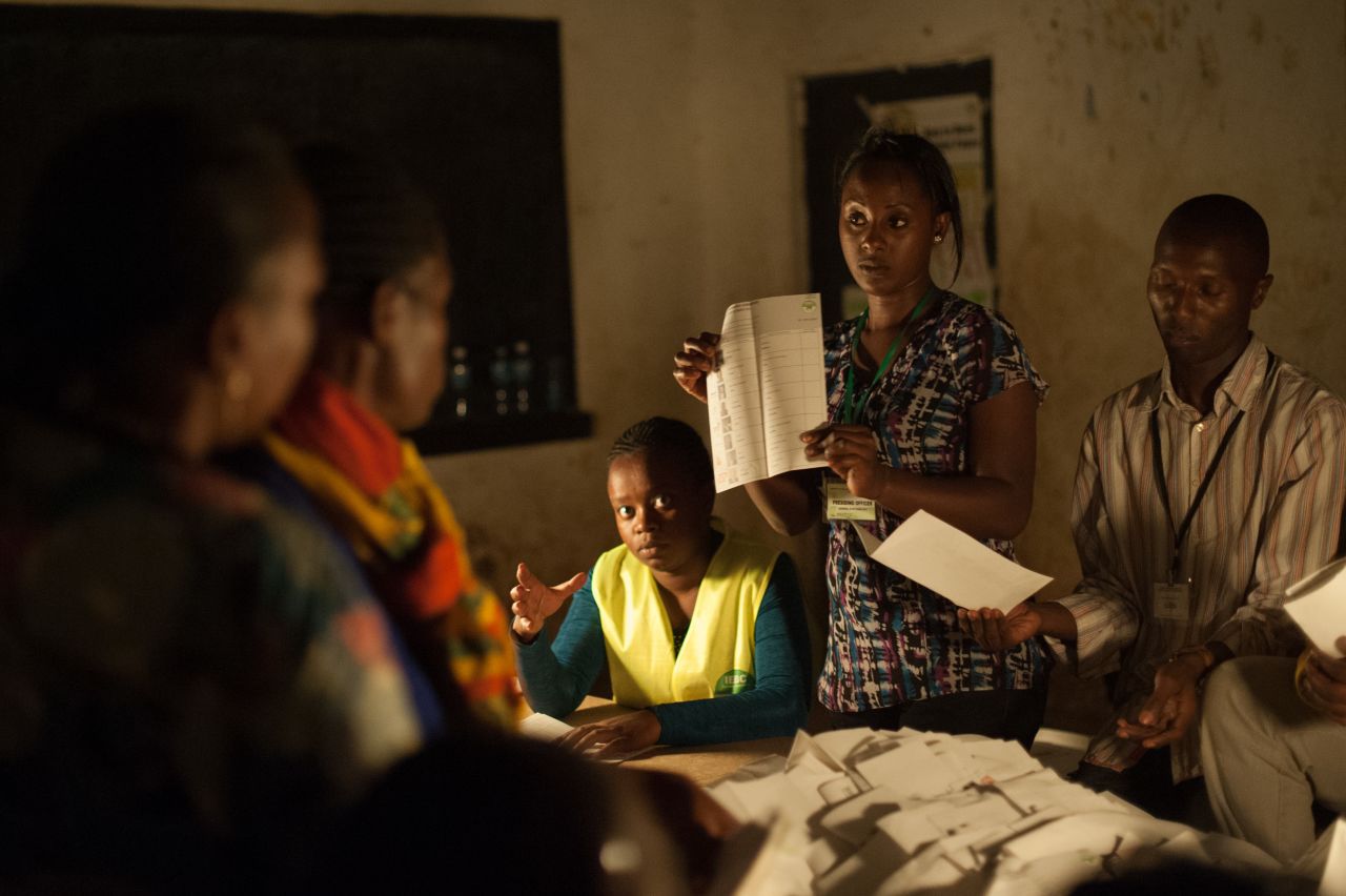 The Presiding Officer from the Independent Electoral and Boundaries Commission (IEBC) shows presidential ballots for counting at a polling station at the Oloolua Primary School in the town of Ngong on March 4, 2013.