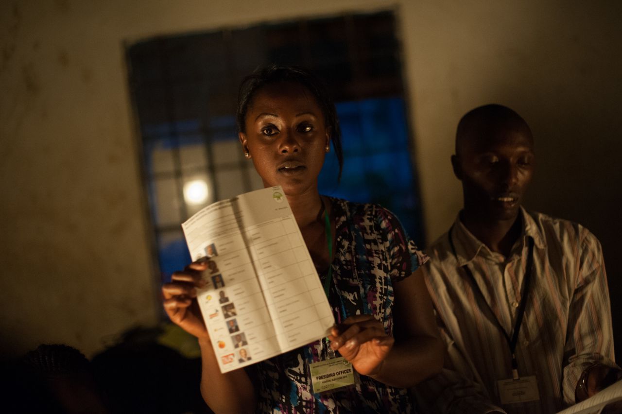 Election officer shows presidential ballots for counting at a polling station at the Oloolua Primary School as voting closes in the town of Ngong, outside of Nairobi.