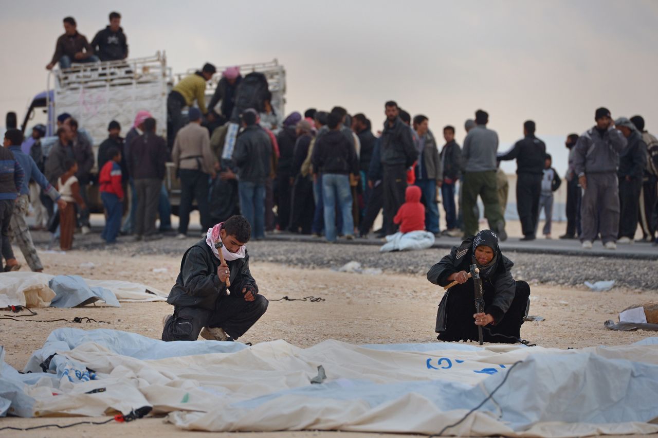 Syrians put up tents at the Zaatari refugee camp in January 2013.