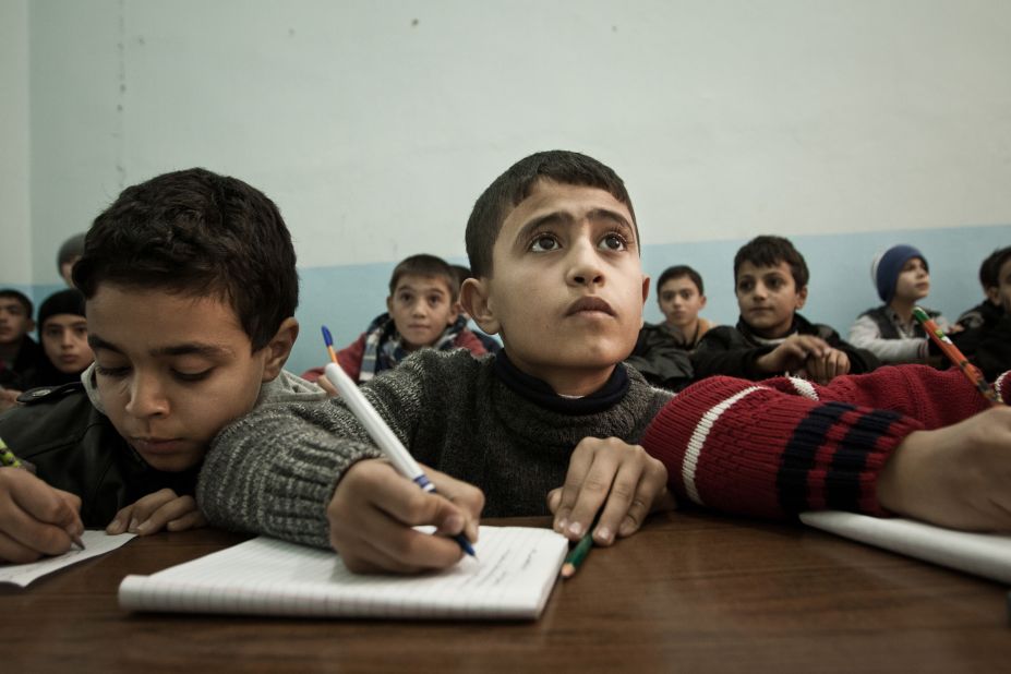 A Syrian boy attends school in the Turkish town of Kilis in December 2012.