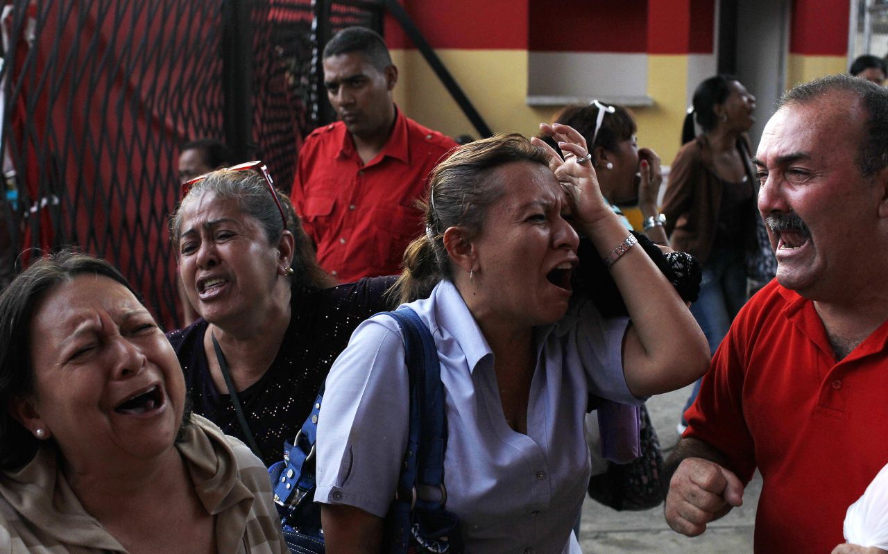 Venezuelans in Caracas react to the news of Chavez's death on March 5.