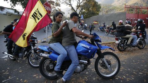 Venezuelans ride motorcycles through Caracas after the announcement of Chavez's death on March 5.