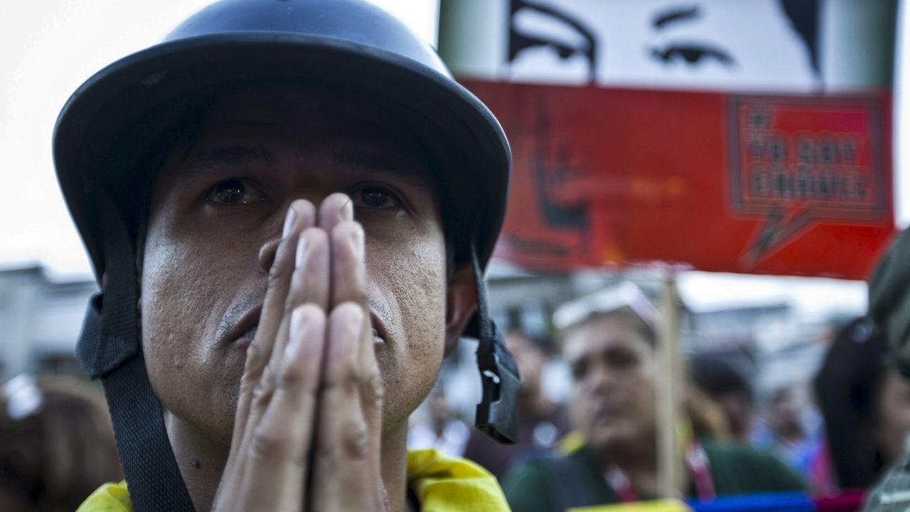A man mourns the death of Chavez outside the Military Hospital in Caracas on March 5.