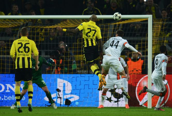 Felipe Santana rises to score Borussia Dortmund's opening goal in their 3-0 home win over Shakhtar Donetsk. 
