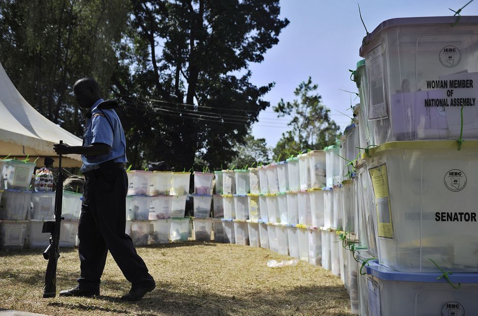 An armed security officer guards ballot boxes on March 5, 2013 that have yet to be tallied in Kakamega, western Kenya, a day after the country held national elections.