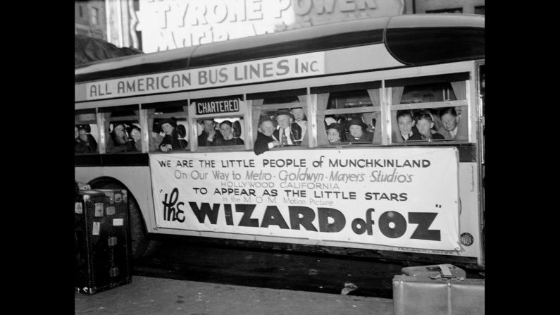 The actors who portrayed the Munchkins aboard a bus headed to the studio for filming.