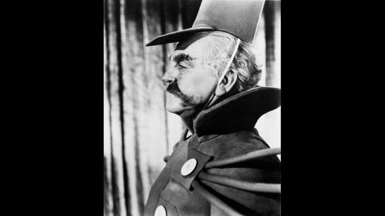 Frank Morgan as the Guardian of the Gates.