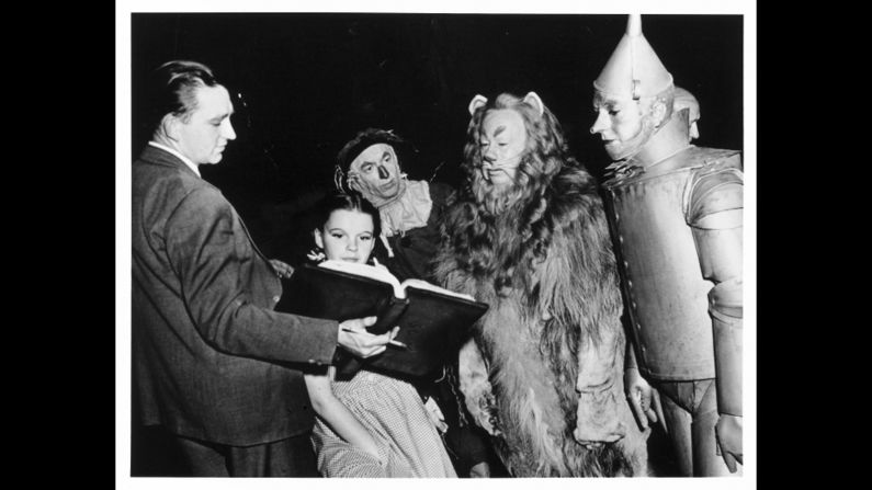 Judy Garland as Dorothy Gale, Ray Bolger as the Scarecrow, Bert Lahr as the Cowardly Lion and Jack Haley as the Tin Man.