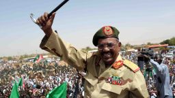 Sudanese President Omar al-Bashir waves to the crowd during his visit to the Northern Kordofan town of El-Obeid to address a rally of freshly-trained paramilitary troops on April 19, 2012. Bashir vowed on April 19, to teach 'a lesson by force' to the South Sudanese government over its seizure of the north's main Heglig oil field. 