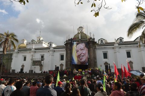 Crowds in Quito, Ecuador, gather around a large photograph of Chavez to pay their respects to the deceased president on March 6. Ecuador's left-leaning president, Rafael Correa, was a Chavez ally. 