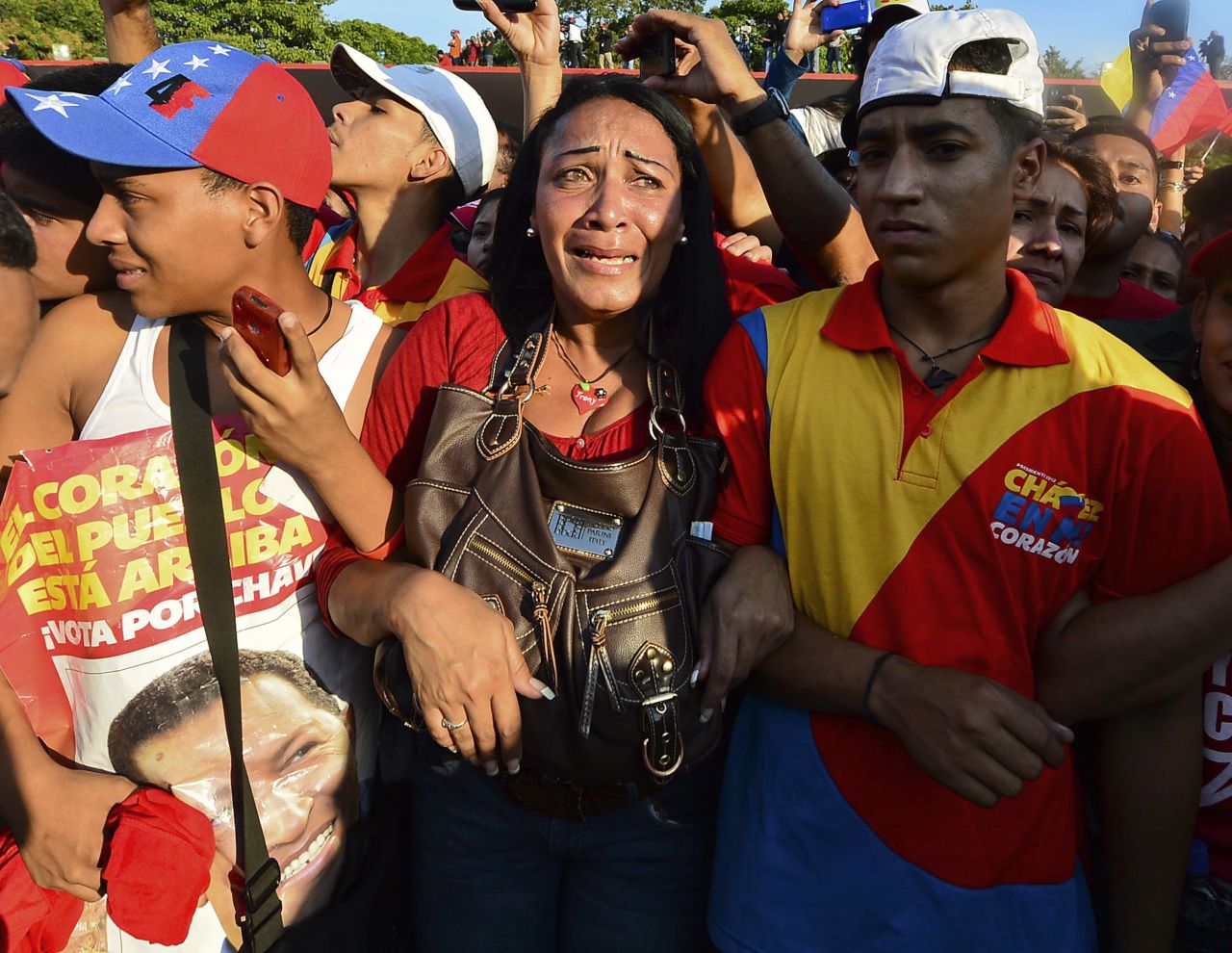 Throngs of Chavez supporters accompany the coffin of the deceased Venezuelan president as it arrives at the Military Academy in Caracas on March 6. 