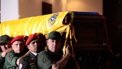 The coffin of the late Venezuelan President Hugo Chavez is carried Wednesday to the Military Academy for his funeral in Caracas.