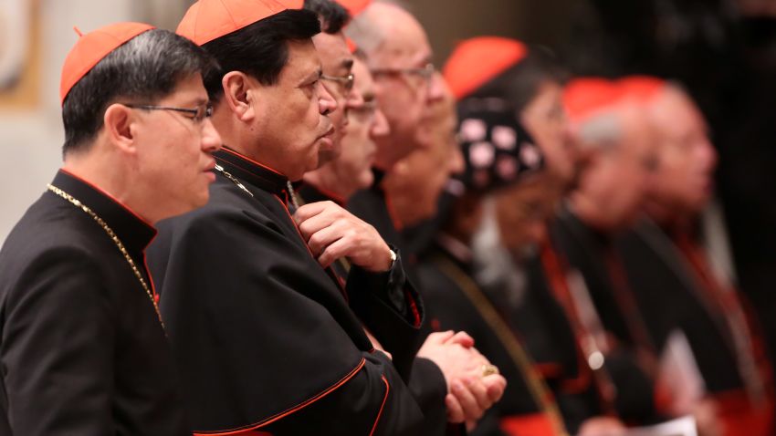 VATICAN CITY, VATICAN - MARCH 06: Filipino cardinal Luis Antonio Tagle (L) and archbishop of Mexico City cardinal Norberto Rivera Carrera (2nd L) attend a meeting of prayer at St. Peter's Basilica on March 6, 2013 in Vatican City, Vatican. The start-date of the conclave to elect a new Pope, following the resignation of Pope Benedict XVI, has yet to be confirmed as many cardinals have sought more time to discuss the issues currently facing the Catholic church. (Photo by Franco Origlia/Getty Images) 
