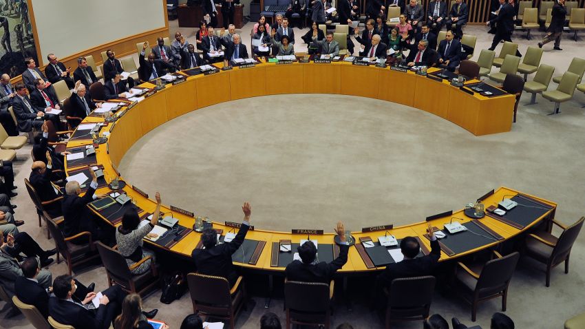 UN Security Council members vote to adopt sanctions against North Korea at the United Nations headquarters in New York, March 7, 2013. 