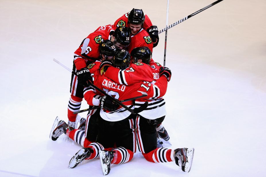 The Chicago Blackhawks are on an impressive unbeaten streak -- 21 games -- this season so far. Here, teammates celebrate their victory over the Colorado Avalanche on Wednesday, March 7, in the United Center in Chicago. Take a look at the Blackhawks, lately and through the years: