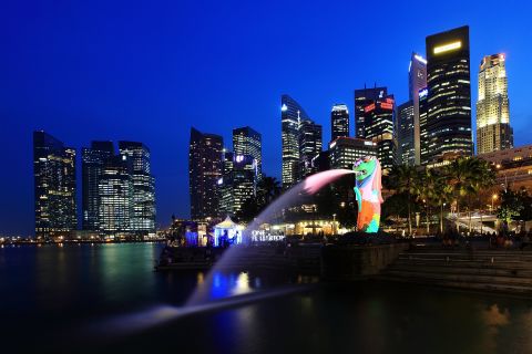 Singapore has its Global Investor Program where applicants can invest $2 million for permanent residency. Citizenship is possible after two years.  Here, a view of the Merlion and the central business district skyline.