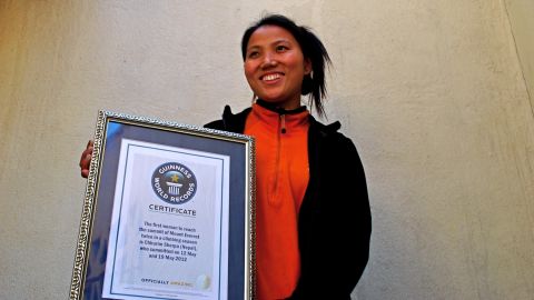 Chhurim Sherpa holds the certificate she received recognizing her double Everest ascent.