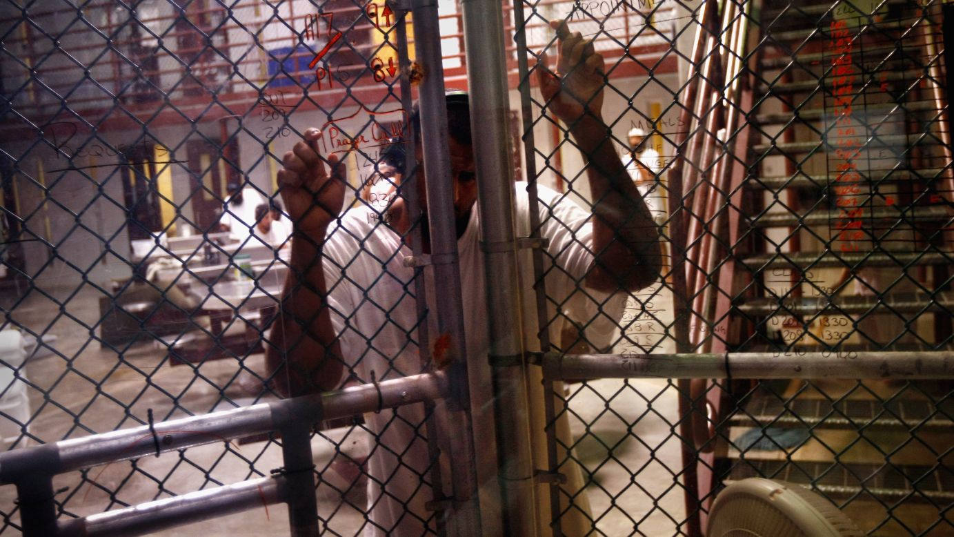 The base at Guantanamo Bay has held <a href="http://www.cnn.com/video/#/video/international/2012/01/11/lkl-verjee-gitmo-10-year-anniversary.cnn">terror suspects since January 2002.</a> Early in the war on terror, the Bush administration argued these detainees were "enemy combatants" who didn't have the protections accorded to prisoners of war under the Geneva Conventions. Here, a detainee stands at an interior fence in October 2009.