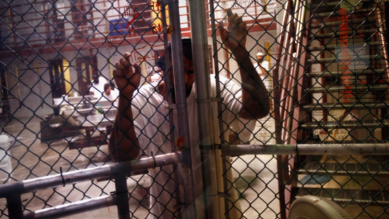 A detainee stands at an interior fence inside the U.S. military prison for "enemy combatants" on October 27, 2009 in Guantanamo Bay, Cuba.