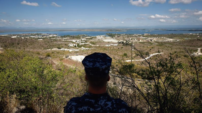 A Navy sailor surveys the base in October 2009. In December 2013, Congress <a href="index.php?page=&url=http%3A%2F%2Fpoliticalticker.blogs.cnn.com%2F2013%2F12%2F26%2Fobama-signs-budget-defense-bills-in-hawaii%2F" target="_blank">passed a defense-spending bill</a> that makes it easier to transfer detainees out of the facility.