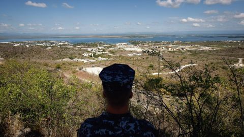 A Navy sailor surveys the base in October 2009. In December 2013, Congress <a href=