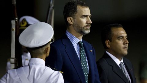 Spanish Crown Prince Felipe, center, arrives at Maiquetia Airport in Caracas on March 8.