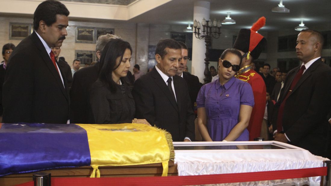 Peruvian President Ollanta Humala, center, views Chavez's body with his wife, Nadine Heredia, second left, on March 7.