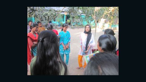 Humaiya Akhter (R) works with young girls in Bangladesh to raise awareness about the damaging effects of child marriage. 