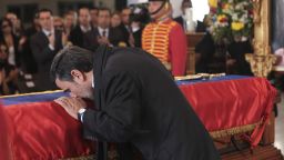 Iran's President Mahmoud Ahmadinejad pays tribute to late Venezuelan President Hugo Chavez during the funeral in Caracas, Venezuela, on Friday, March 8.