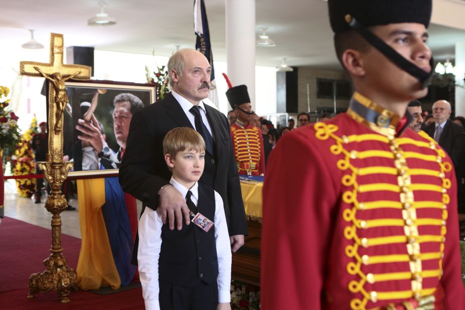 Belarus President Alexander Lukashenko and his son Nikolay stand next to the coffin of Chavez during the funeral on March 8.