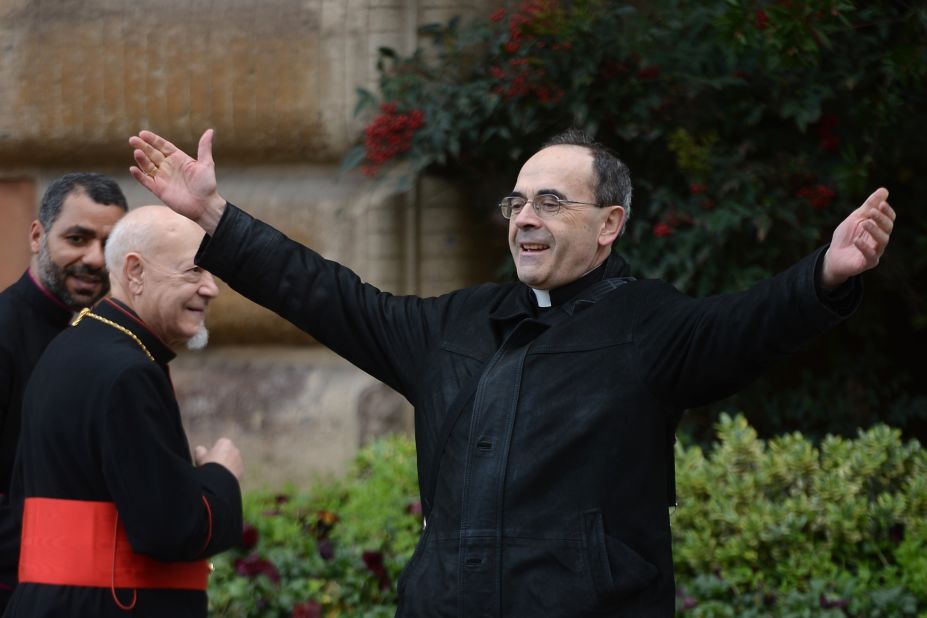 French Cardinal Philippe Barbarin greets colleagues as he arrives for a pre-conclave meeting on Saturday, March 9.