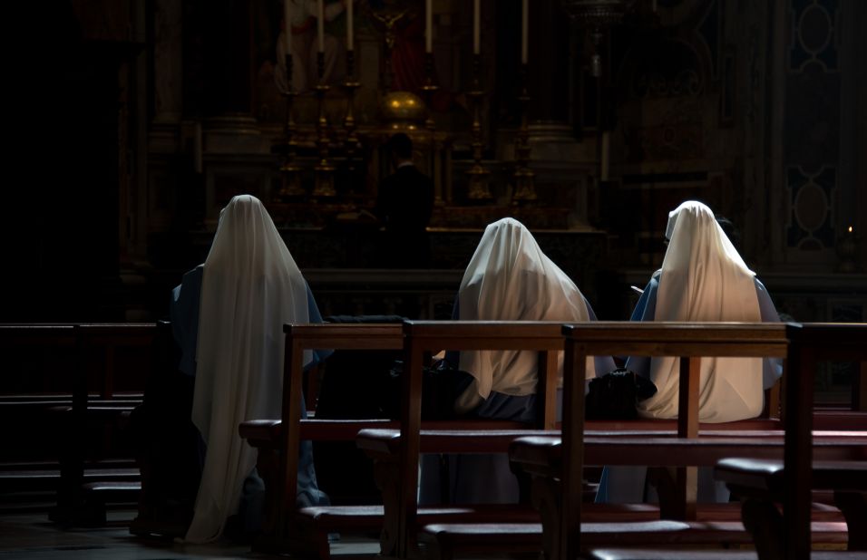 Nuns pray inside St. Peter's Basilica on March 10.