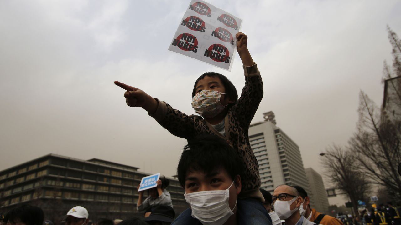 A boy takes part in an anti-nuclear march in Tokyo on Sunday. The radiation crisis that stemmed from the earthquake and tsunami shattered public trust in nuclear power.