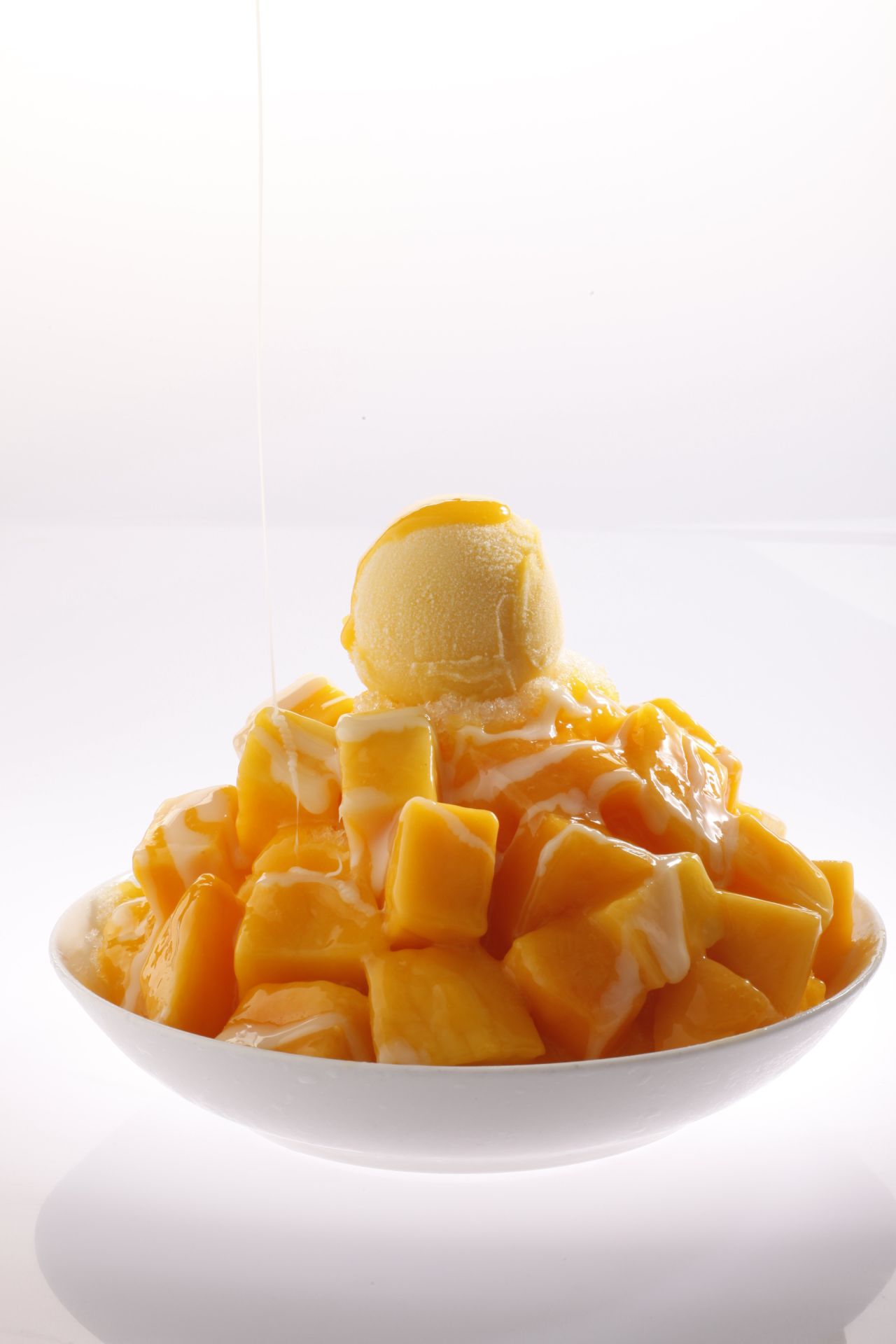 Ignore the candy-colored popsicles up front. What you want is the "mango avalanche"—shaved ice piled high with cubes of fresh fruit, mango pudding, condensed milk, and mango sorbet. It's enough for four dainty eaters or two ravenous ones. Website: ice-monster.com