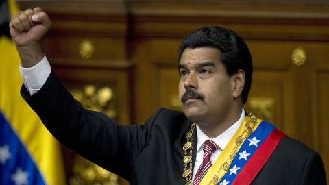 Venezuelan acting president Nicolas Maduro clenches his fist after he was sworn in, in Caracas, on March 8, 2013.
