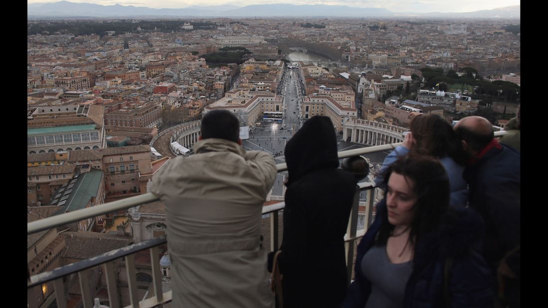 Tourists take in the view from the cupola on St. Peter's Basilica on March 10.