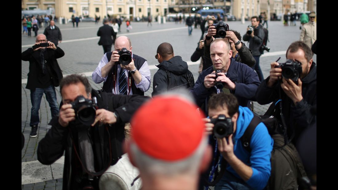 Canadian Cardinal Marc Ouellet is photographed by media as he leaves the final congregation on March 11.