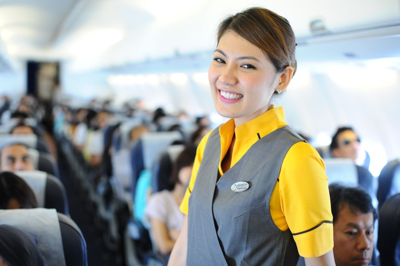 An actual flight attendant from Nok Air smiles for the camera. Nok Air's CEO Patee Sarasin says no flight attendant is over 30 because customers prefer younger staff. 