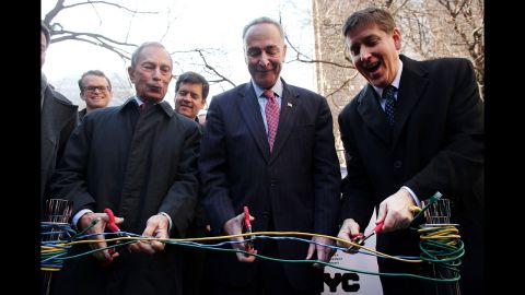 From left, Bloomberg, New York Sen. Charles Schumer and Ben Fried, chief information officer for Google, cut Ethernet cables at a news event where it was announced that free Wi-Fi would be provided to the Manhattan neighborhood of Chelsea in January 2013. 