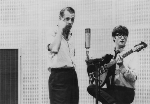 John Lennon is seen with George Martin, the band's producer often dubbed the fifth Beatle, who first signed the Beatles to his Parlophone label when they were unknown. He then oversaw their rise to fame and wrote or performed many of the orchestral arrangements in their songs.